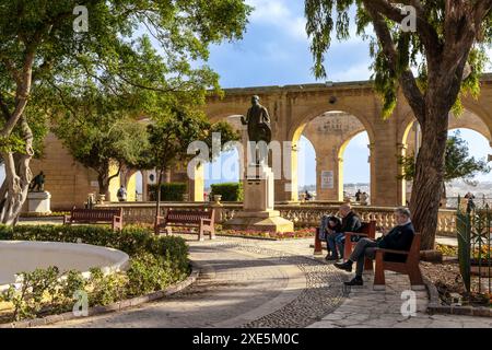 People enjoying a sunny afternoon in the historic Upper Barrakka Gardens in downtown Valletta Stock Photo