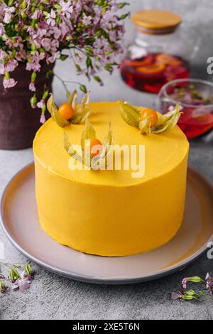 Tasty mango mousse cake on plate Stock Photo