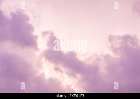 Background of a beautiful pink and pale purple sky with clouds at sunset Stock Photo