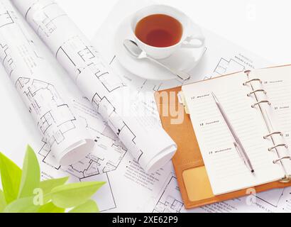 Drawings, tea and system notebook Stock Photo