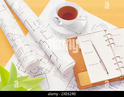 Drawings, tea and system notebook Stock Photo