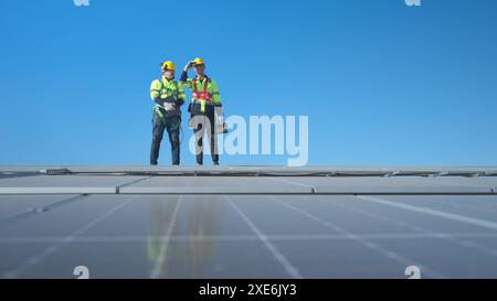 Both of technician working on a photovoltaic solar panels Stock Photo
