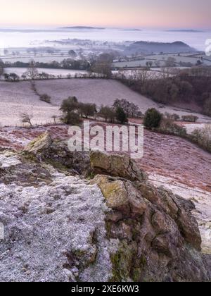 Dramatic and beautiful misty winter conditions viewed from the top of Ragleth Hill near Church Stretton, South Shropshire, England, UK Stock Photo