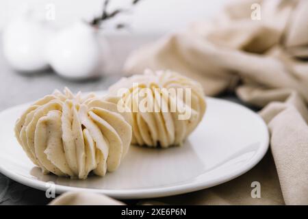 Closeup vanilla cream on white plate Stock Photo