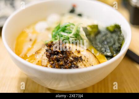 Close up of ramen noodles in bowl on table Stock Photo