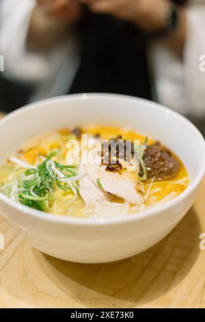 Close up of ramen noodles in bowl on table Stock Photo