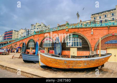 Brighton and Hove, England, UK - June 23, 2024: “Front Entrance of Fisherman Museum in Brighton with Traditional English Boats and Historic Bridge in Stock Photo