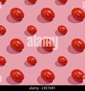 Easter composition pattern in red shades. Painted eggs on a pink background. Stock Photo