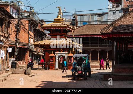 Small Hindu temple with golden roof in Bhaktapur, Kathmandu Valley, Nepal, Asia Stock Photo