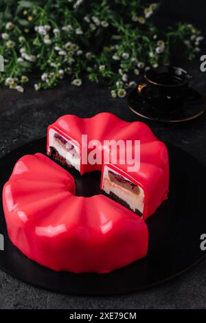 Contemporary Chocolate Cherry Mousse Cake covered with cherry icing Stock Photo