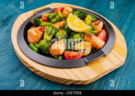 Grilled salmon with vegetables in a pan Stock Photo