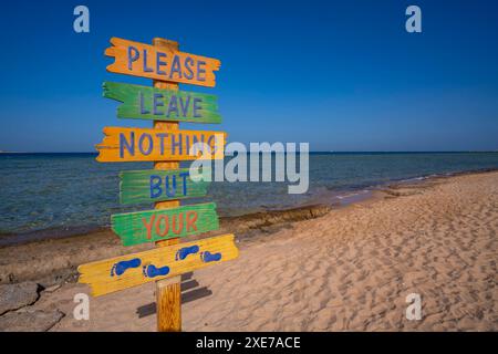 View of sign reading Please Leave Nothing But Your Footprints on the Beach, Sahl Hasheesh, Hurghada, Red Sea Governorate, Egypt, North Africa, Africa Stock Photo