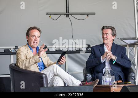 BROADCHALKE, WILTSHIRE, UK, 26th June, 2024, Feargal Sharkey talks about the importance of the Chalk Stream with Guy Walters at Chalke History Festival, the UK's leading history festival. The event attracts hundreds of thousands of history enthusiasts, including tens of thousands of school children. Credit John Rose/Alamy Live News Stock Photo