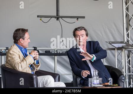 BROADCHALKE, WILTSHIRE, UK, 26th June, 2024, Feargal Sharkey talks about the importance of the Chalk Stream with Guy Walters at Chalke History Festival, the UK's leading history festival. The event attracts hundreds of thousands of history enthusiasts, including tens of thousands of school children. Credit John Rose/Alamy Live News Stock Photo
