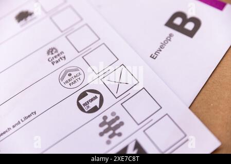 Postal vote with an X in the box for the Reform UK Party, for the 2024 UK General Election. Ballot paper voting Stock Photo