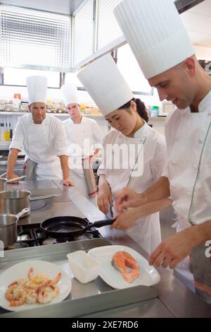 Sauteing prawns y salmon. Luis Irizar cooking school. Donostia, Gipuzkoa, Basque Country, Spain Stock Photo