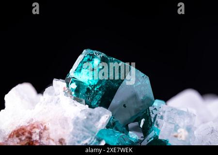 Green Dioptase with white calcite. Specime from Tsumeb, Namibia. macro photography detail texture background. close-up raw rough unpolished semi-preci Stock Photo