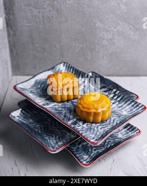 Two chinese cakes on traditional plates Stock Photo