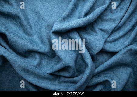 blue insulating curtain, heavy textile, crumpled texture for house insulation Stock Photo