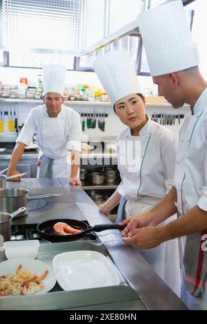 Sauteing prawns y salmon. Luis Irizar cooking school. Donostia, Gipuzkoa, Basque Country, Spain Stock Photo