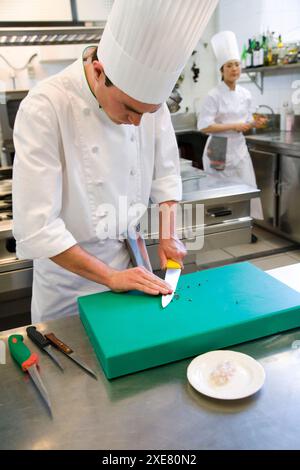 Chefs chopping up black pepper. Luis Irizar cooking school. Donostia, Gipuzkoa, Basque Country, Spain Stock Photo