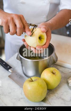 Peeling apples. Luis Irizar cooking school. Donostia, Gipuzkoa, Basque Country, Spain Stock Photo