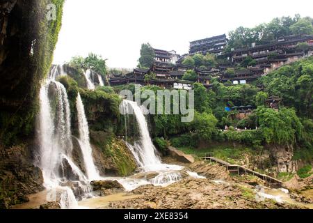 Cityscape historic buildings or heritage antique architectural of Furong Zhen Tujia ancient town city and landscape Wangcun Pubu waterfall for chinese Stock Photo