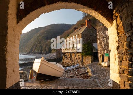 Clovelly harbour through archway, Devon, England. Spring (April) 2019. Stock Photo