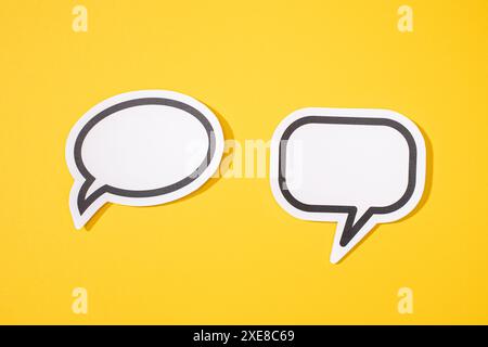 Two Blank Speech Bubble isolated on yellow background. Mock up template Stock Photo