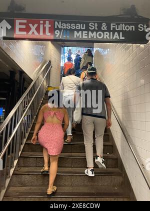 Riders exit the Fulton Street subway station in lower Manhattan. Stock Photo