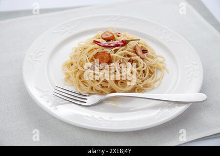 spaghetti aglio olio peperoncino italian on table Stock Photo