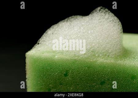 Foam on a green sponge Stock Photo