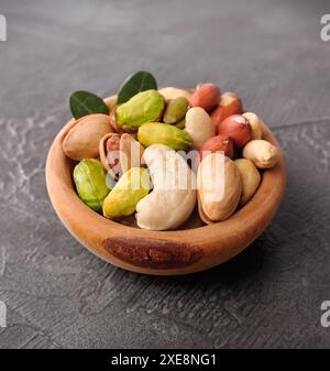Mix of nuts in wooden plate Stock Photo