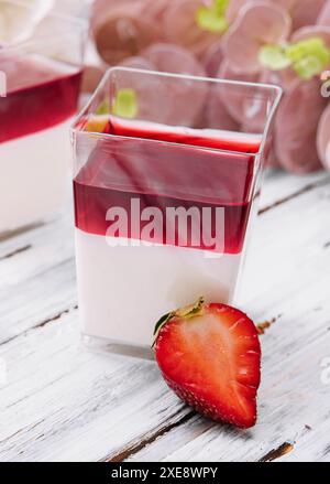 Panna cotta with jelly strawberries, italian dessert Stock Photo