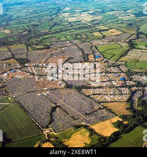Aerial Image Glastonbury Festival, a wide shot showing the entire festival site. Sat 28th June 2003, Worthy farm, Pilton, near Glastonbury, Somerset, England, UK Stock Photo