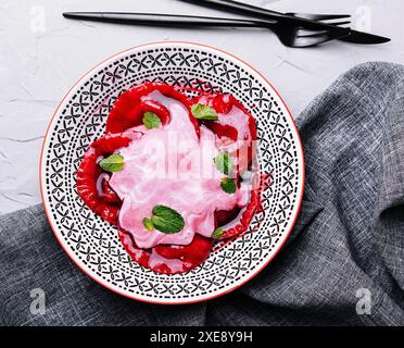 Vegan red ravioli with beetroot on a plate in cream sauce Stock Photo ...