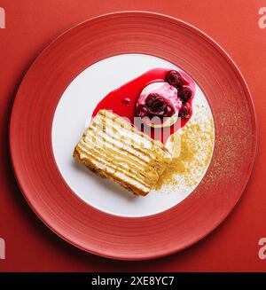 Napoleon cake with vanilla ice cream with cherry jam Stock Photo