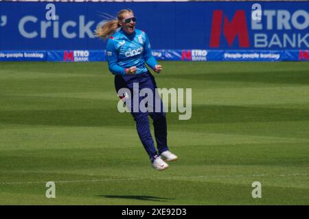 Chester le Street, 26 June 2024. Sophie Ecclestone bowling for England against New Zealand jumping for joy after taking a wicket in the First Metro Bank One Day International at Seat Unique Riverside. Credit: Colin Edwards/Alamy Live News Stock Photo