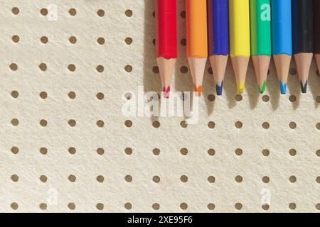 Pencils in different colors and clips on light background Stock Photo