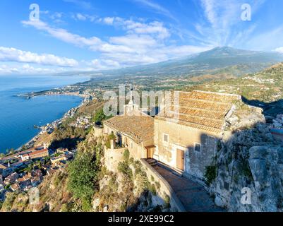 Landscape with Etna volcano and Taormina town aerial panoramic view, Sicily, Italy. Stock Photo