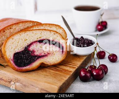 Homemade sweet cherry loaf cake on board Stock Photo