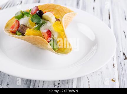 Two scoops of natural organic fruit ice cream in a wafer cup Stock Photo