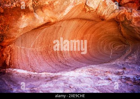 natural cave formed in the red rock of the Andean desert Stock Photo