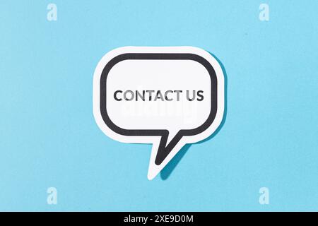 Contact Us text on speech bubble isolated on blue background Stock Photo