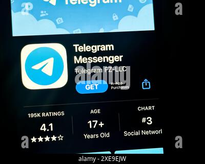 Cupertino, California, USA. 24th June, 2024. A user viewing the Telegram app in the iOS Apple App Store. Telegram Messenger Inc. is an American cloud-based instant messaging service that offers encrypted messaging, voice calls, and file sharing. The company operates in the communication industry and is headquartered in Dubai, United Arab Emirates. Pavel Durov is the CEO. Telegram does not have a publicly traded stock ticker. Core products include secure messaging, channels, groups, and bots. Telegram is known for its focus on privacy and security. (Credit Image: © Taidgh Bar Stock Photo