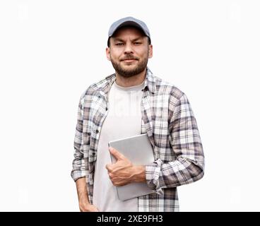 Portrait of adult man wearing casual clothes holding digital tablet in hand and looking at camera and smiling. Stock Photo