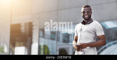Man Using Phone in City Stock Photo