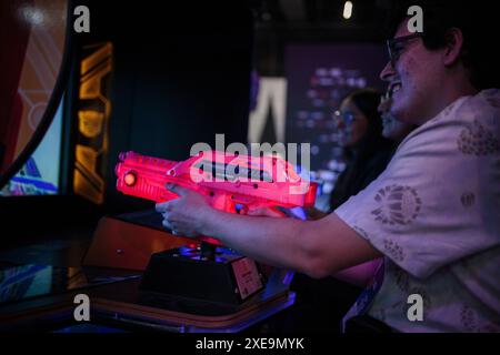 Sao Paulo, Brazil. 26th June, 2024. People play at the opening of Gamescom, the world's largest computer game and video game trade fair. Brazil is now the third Gamescom venue in addition to the home venue in Cologne and an offshoot in Singapore. Credit: Jardiel Carvalho/DPA/dpa/Alamy Live News Stock Photo