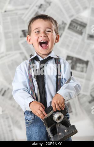 portrait of cheerful little boy on grey background Stock Photo