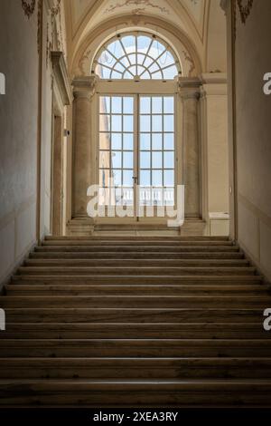 Ancient dark staircase - Grunge interior, nobody, empty building architecture, window. Stock Photo